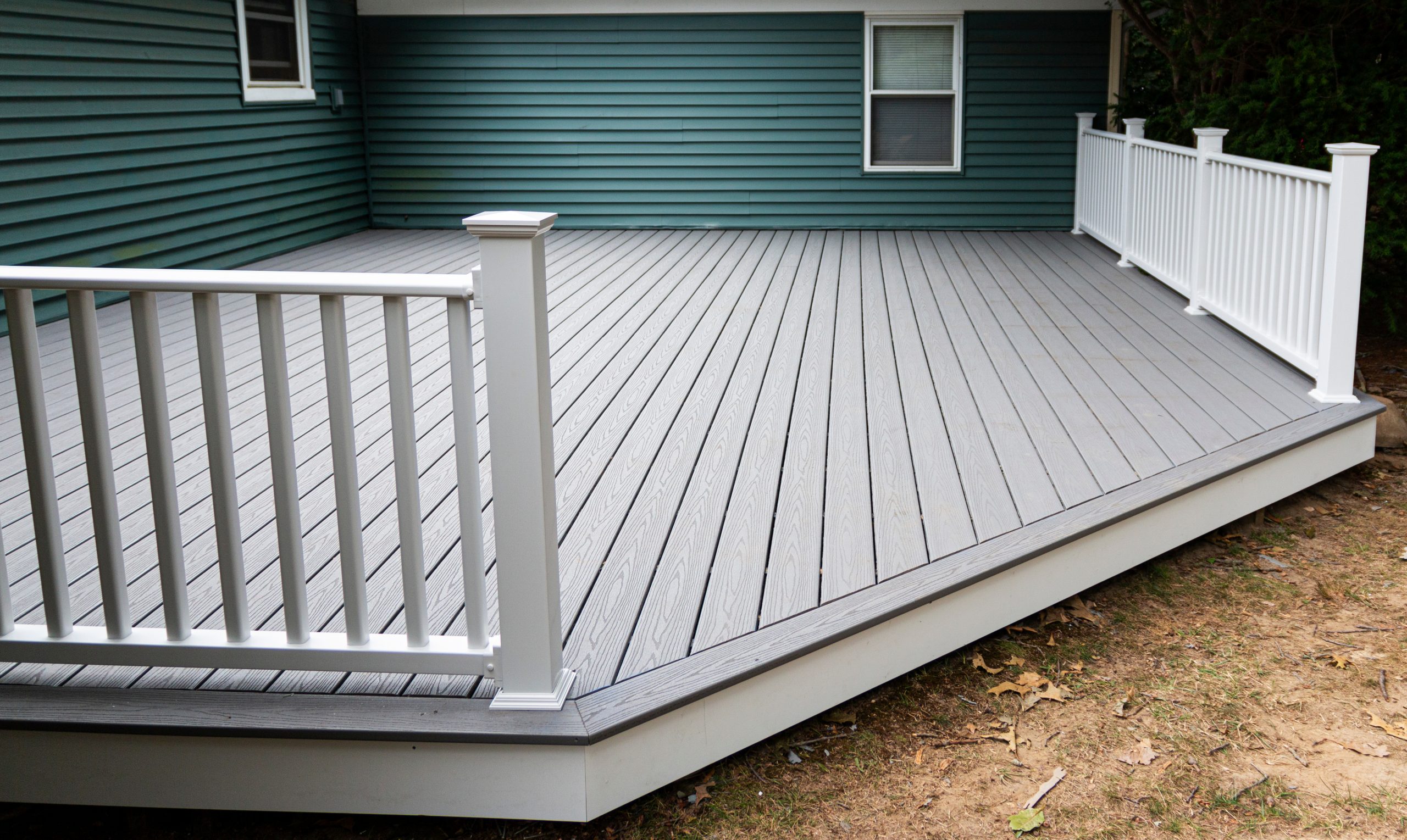 New,Composite,Deck,On,The,Back,Of,A,House,With